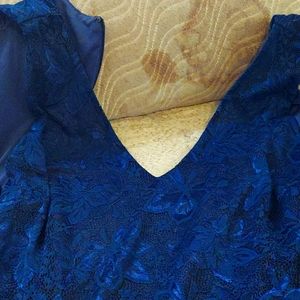 Blue sleeveless formal dress with flowers